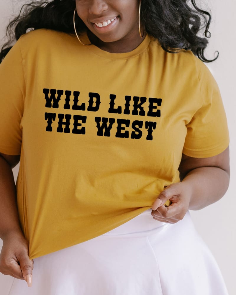 Front of a model wearing a size 2XL Wild Like The West in Mustard by Simply Sage Market. | dia_product_style_image_id:281641